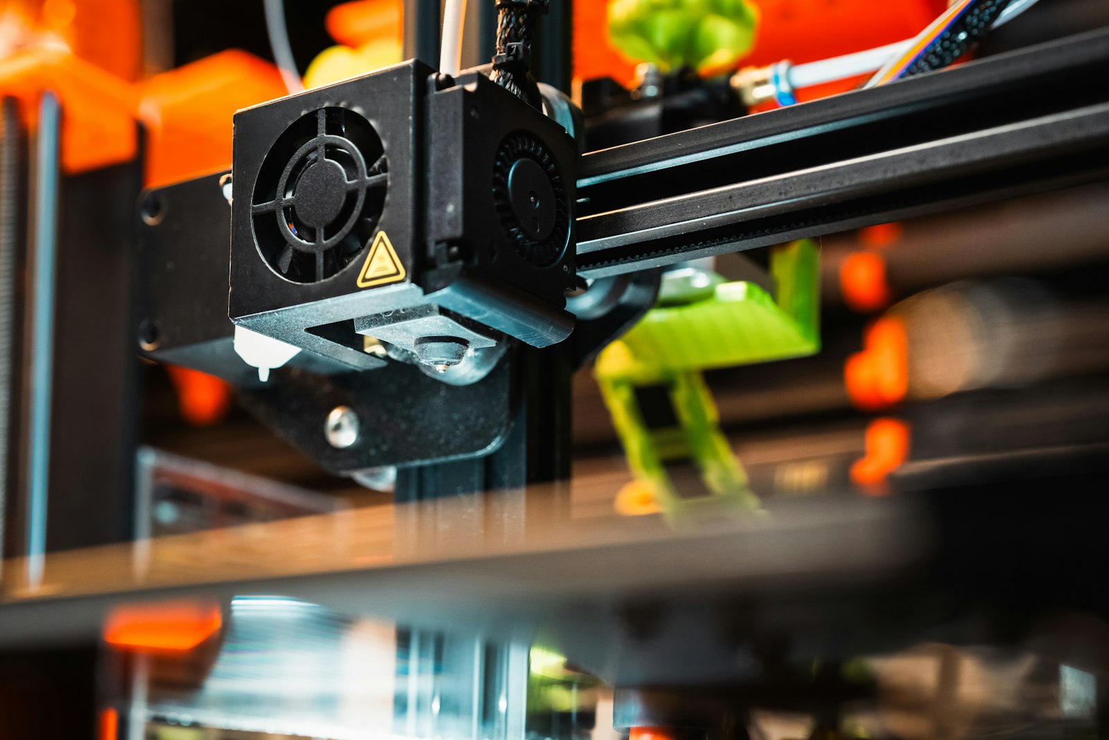 Close-up of a 3D printer extruder printing a part